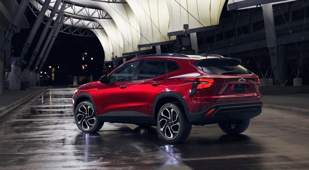 Red 2024 Chevy Trax RS parked in a modern gallery