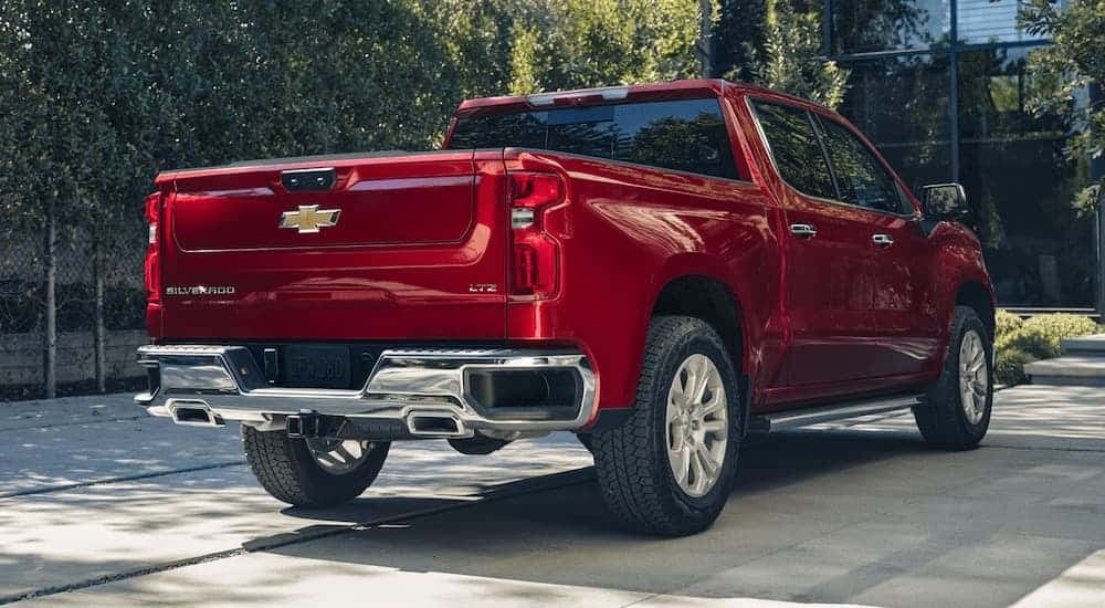 Tailgate on a red 2026 Chevy Silverado 1500 parked in a driveway.