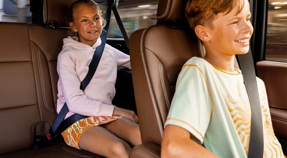 Two children riding in a 2025 Chevy Suburban