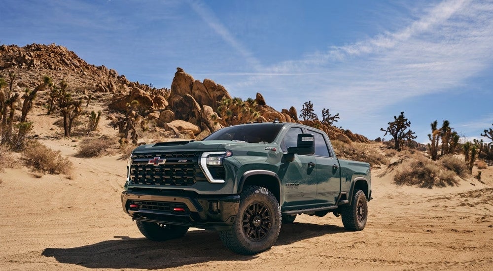Green 2026 Chevy Silverado 2500 HD ZR2 parked off road