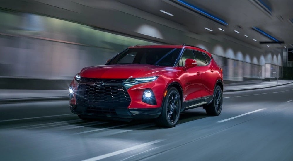 Red 2020 Chevy Blazer RS driving to a Mountain Brook used Chevy dealer