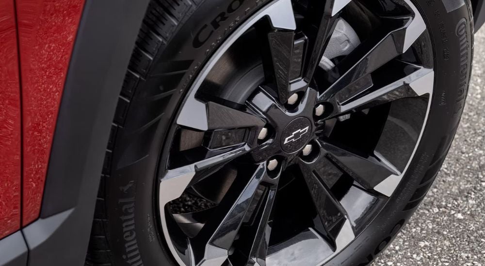 Tire and rim on a red 2026 Chevy Equinox for sale near Mountain Brook
