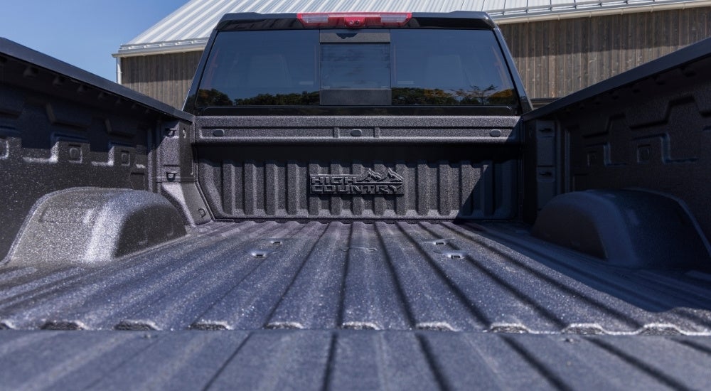 Empty bed on a black 2026 Chevy Silverado 2500 HD High Country