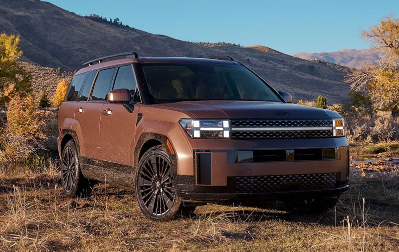 A rugged 2026 Hyundai Santa Fe SUV, emphasizing its durability and capability for off-road driving.