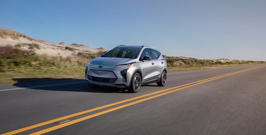 Chevy EV driving along the coast of the ocean
