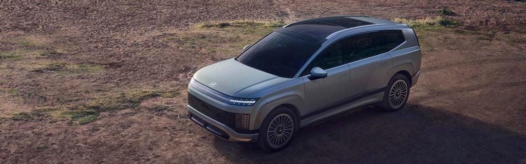 Overhead shot of a Hyundai SUV, highlighting its modern shape and features against a clear background.