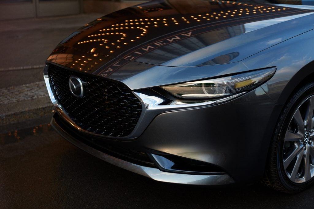 close up photo of a the hood of a Mazda3