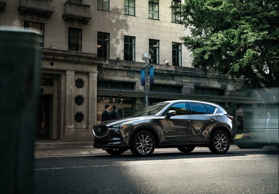 dark gray Mazda CX-5 parked downtown