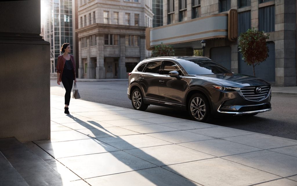 Mazda SUV in black parked downtown