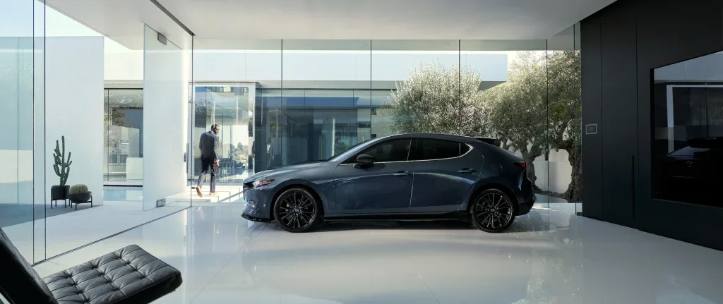 dark blue Mazda parked inside a modern home