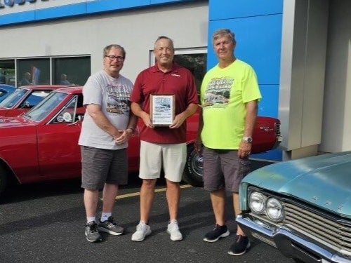 Chevelle-500x375.jpg 3 men standing
