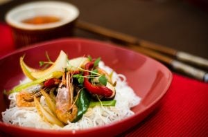 a bowl full of Chinese food