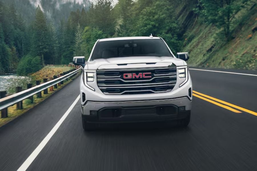 white GMC sierra 1500 on road