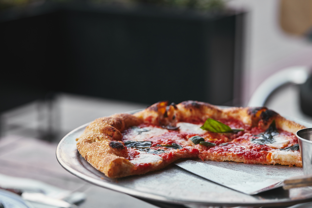 whole pizza sliced on a plate