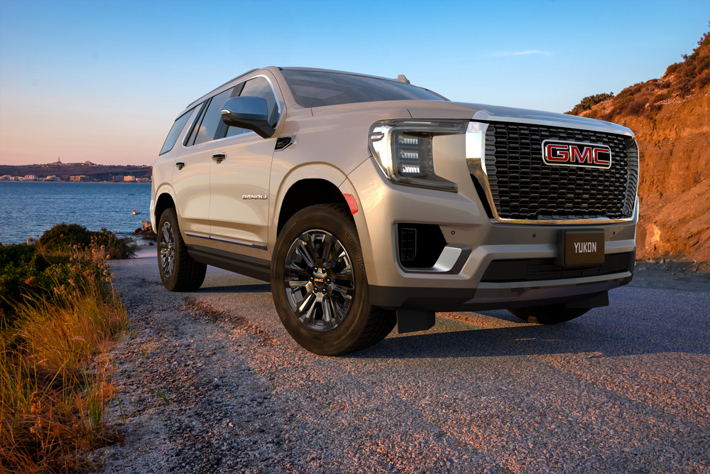 gold 2021 gmc yukon left angle view during sunset