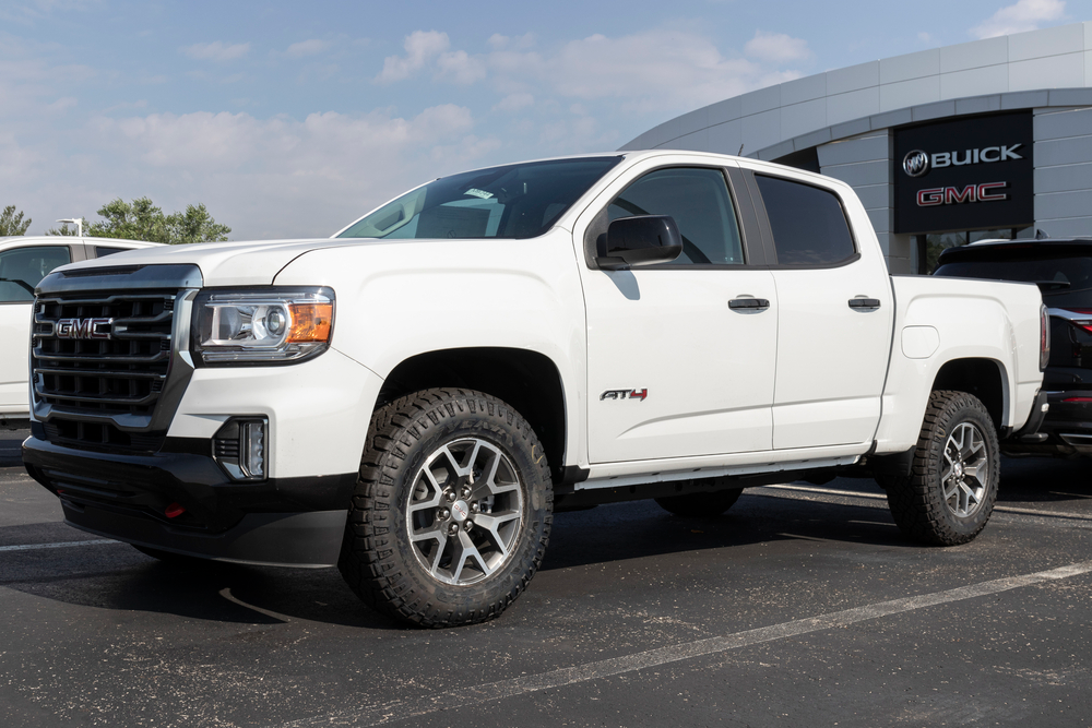 white 2021 gmc sierra 1500 left side angle view