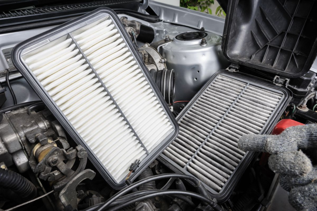 The image shows a comparison between a clean and dirty car air filter inside the engine compartment.