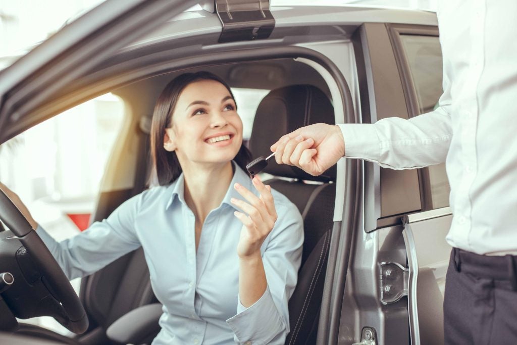Girl test driving a car