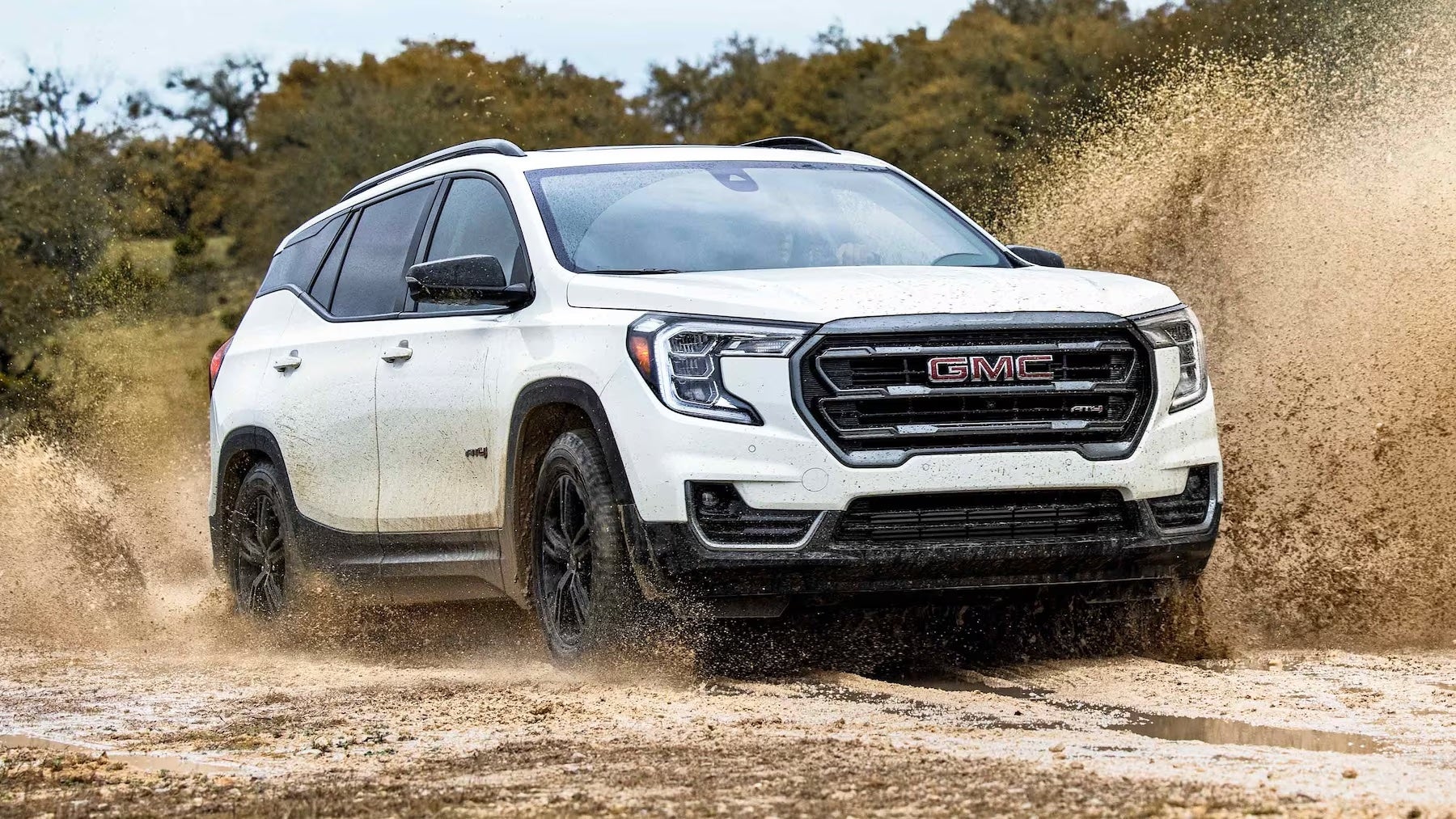 The 2023 GMC Terrain AT4 off-roading through dirt
