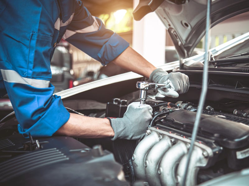 Technician working on vehicle