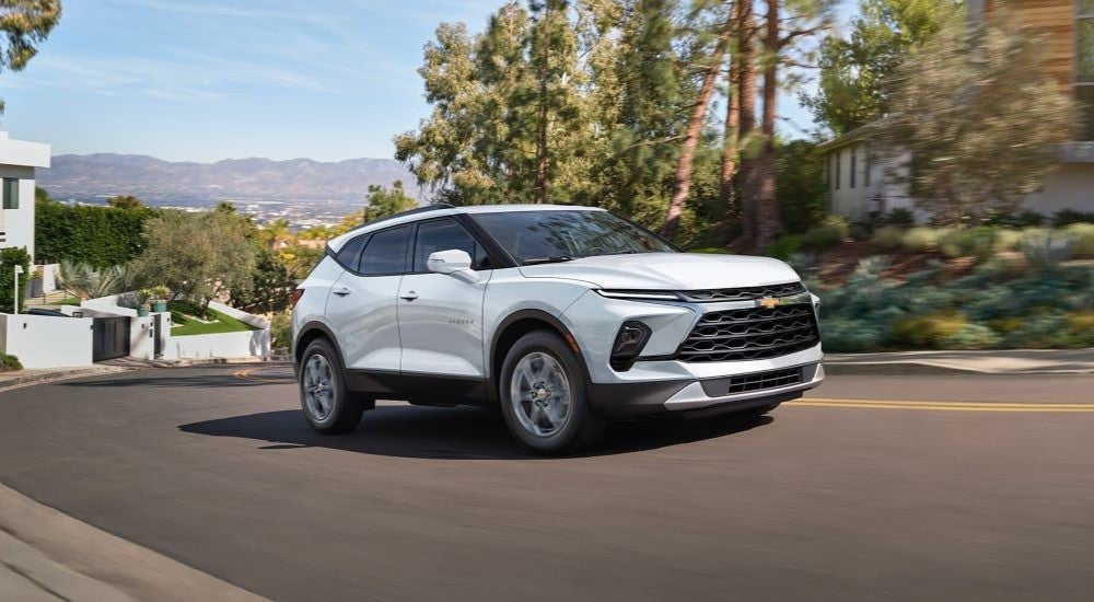 White 2024 Chevy Blazer for sale rounding a corner