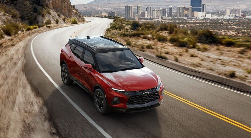 Red 2021 Chevy Blazer RS driving on a winding road