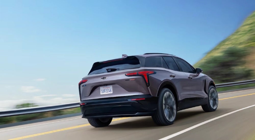 Grey 2025 Chevy Blazer EV for sale driving on a highway