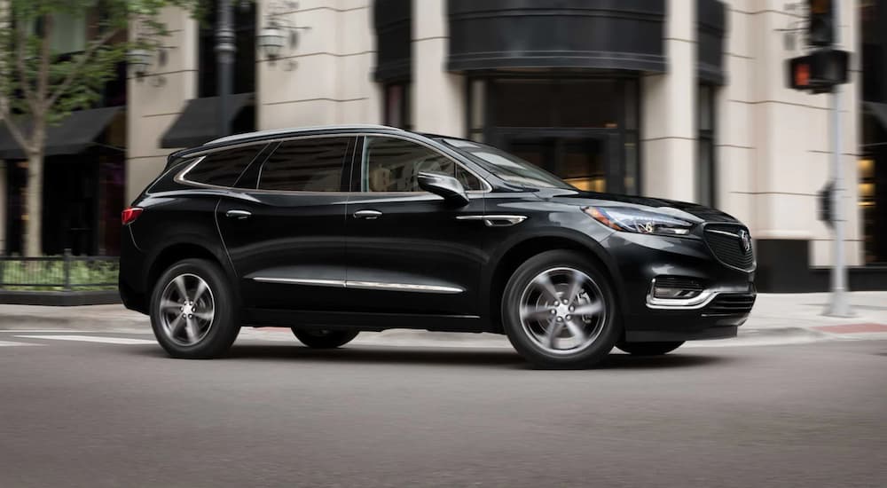 Black 2021 Buick Enclave driving in a city