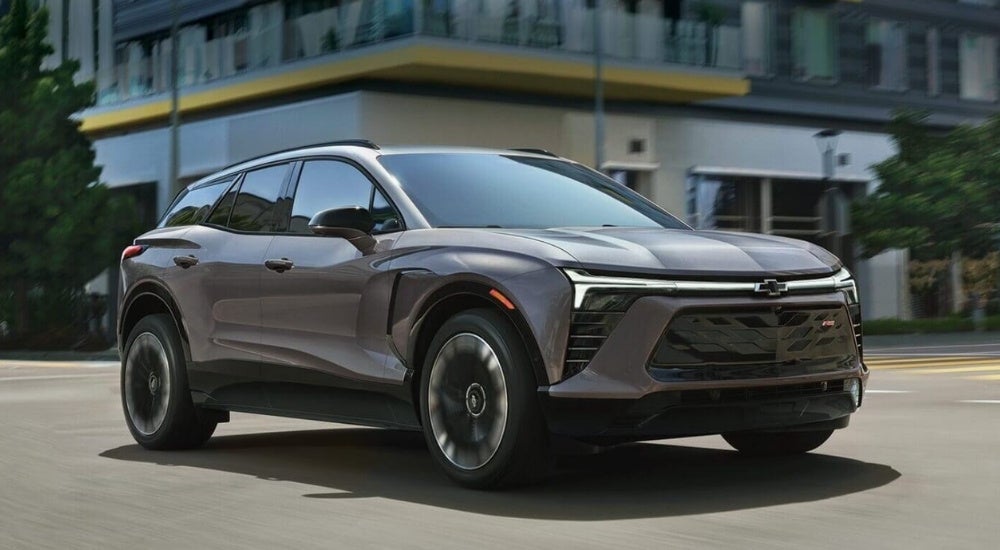 Grey 2025 Chevy Blazer EV driving through an intersection