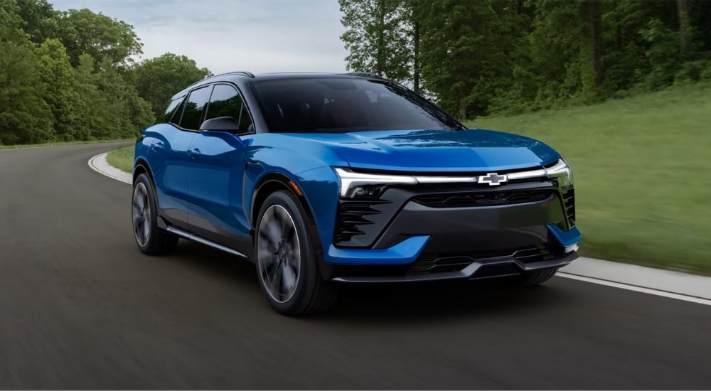 Blue 2025 Chevy Blazer EV SS rounding a corner