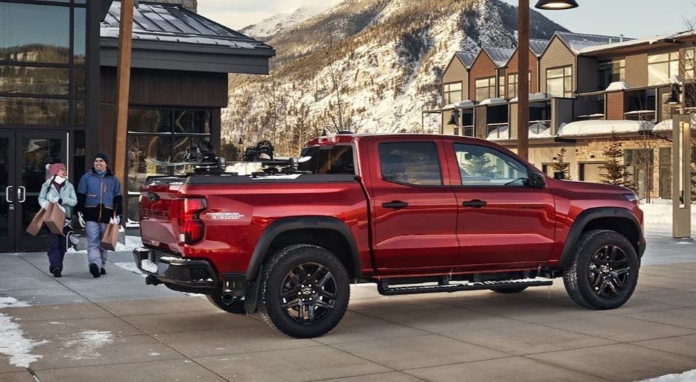 Red 2024 Chevy Colorado Trail Boss parked at a ski resort