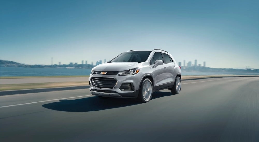 Silver 2021 Chevy Trax driving to a Chevy dealer near Port Huron