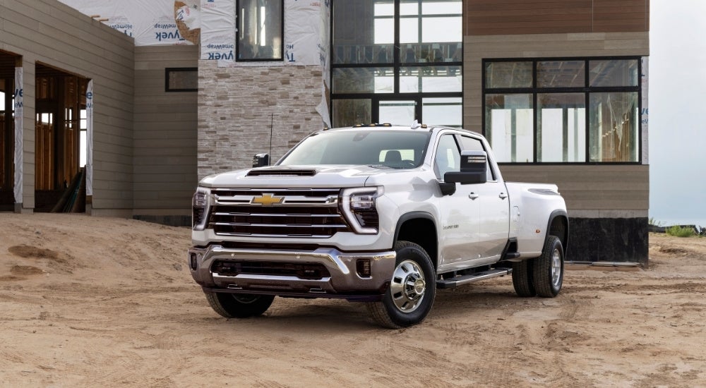 A white 2024 Chevy Silverado 3500 HD is shown from the front at an angle.