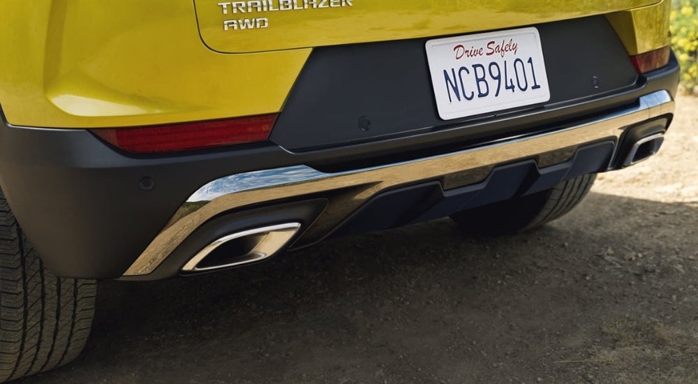 A close-up on the rear bumper of a yellow 2025 Chevy Trailblazer ACTIV.