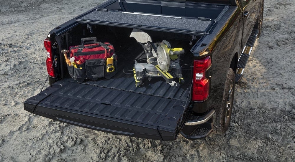Rear view of a red 2024 Chevy Silverado 1500 with bed liner and Multi-Flex tailgate.