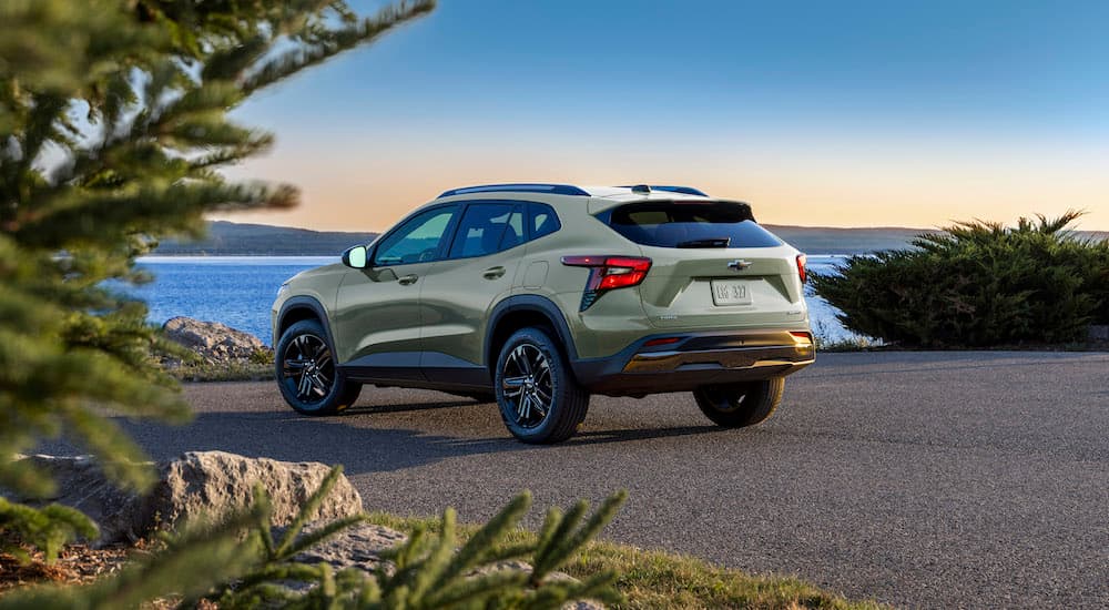 A green 2024 Chevy Trax ACTIV is shown from the rear at an angle.