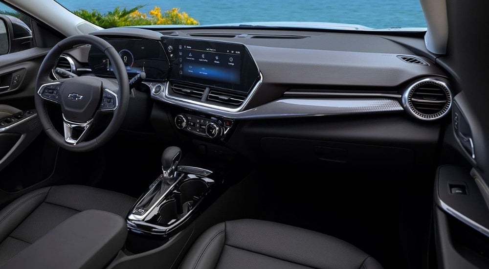The black interior and dash in a 2025 Chevy Trax for sale is shown.
