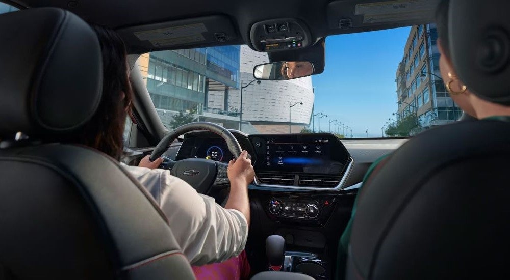 The black interior and dash in a 2025 Chevy Trax for sale is shown.