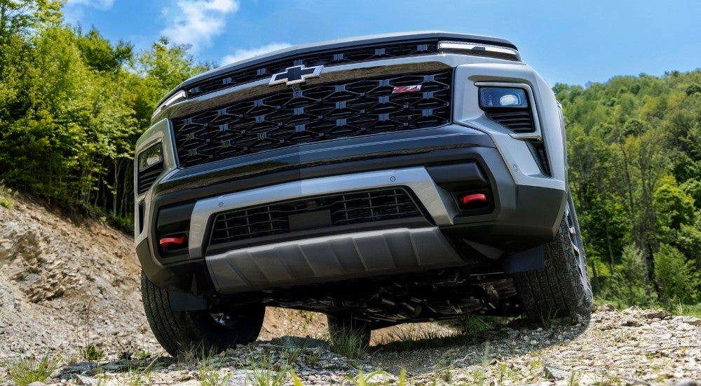 A low angle close-up on the grille of a grey 2024 Chevy Traverse Z71.