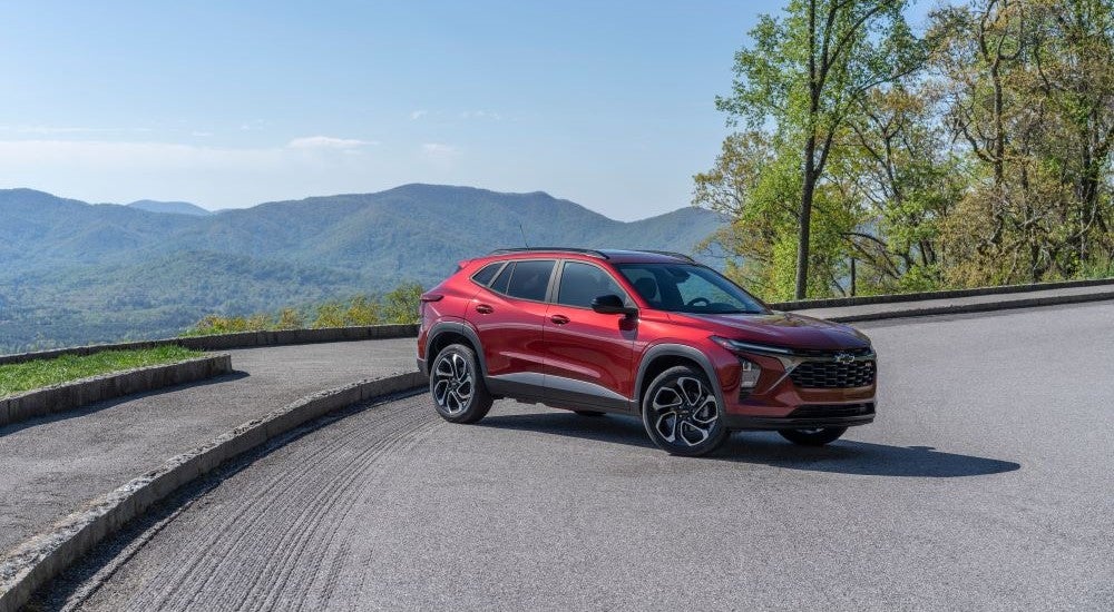 A red 2024 Chevy Trax RS is shown from the front at an angle after leaving a Ripley Chevy dealer.