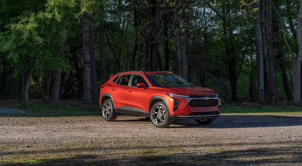 A red 2024 Chevy Trax LT is shown from the front at an angle.