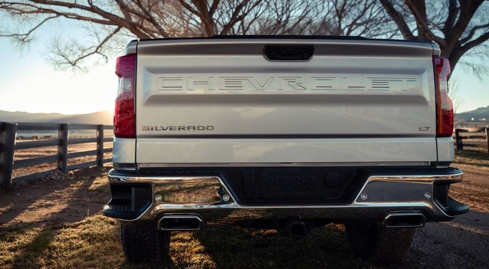 A close-up show the tailgate on a silver 2024 Chevy Silverado 1500 LT.