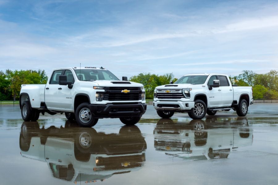 2 white Chevrolet Silverado 1500