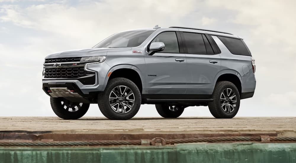Silver 2021 Chevy Tahoe Z71 parked near a lake.
