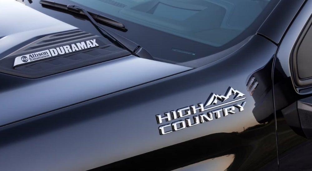 A close up shows the High Country badge on a 2025 Chevy Silverado 2500 for sale.