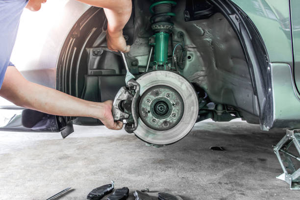 Someone working on brake pads