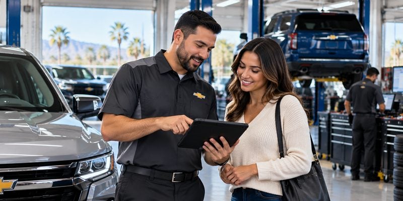 Service advisor discussing vehicle service information with a customer