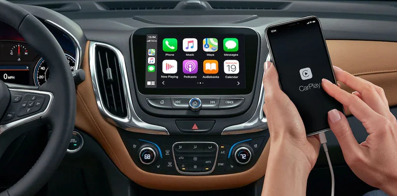 Interior dash photo of a Chevy BoltEV featuring the infotainment screen and a phone hooked up to the car