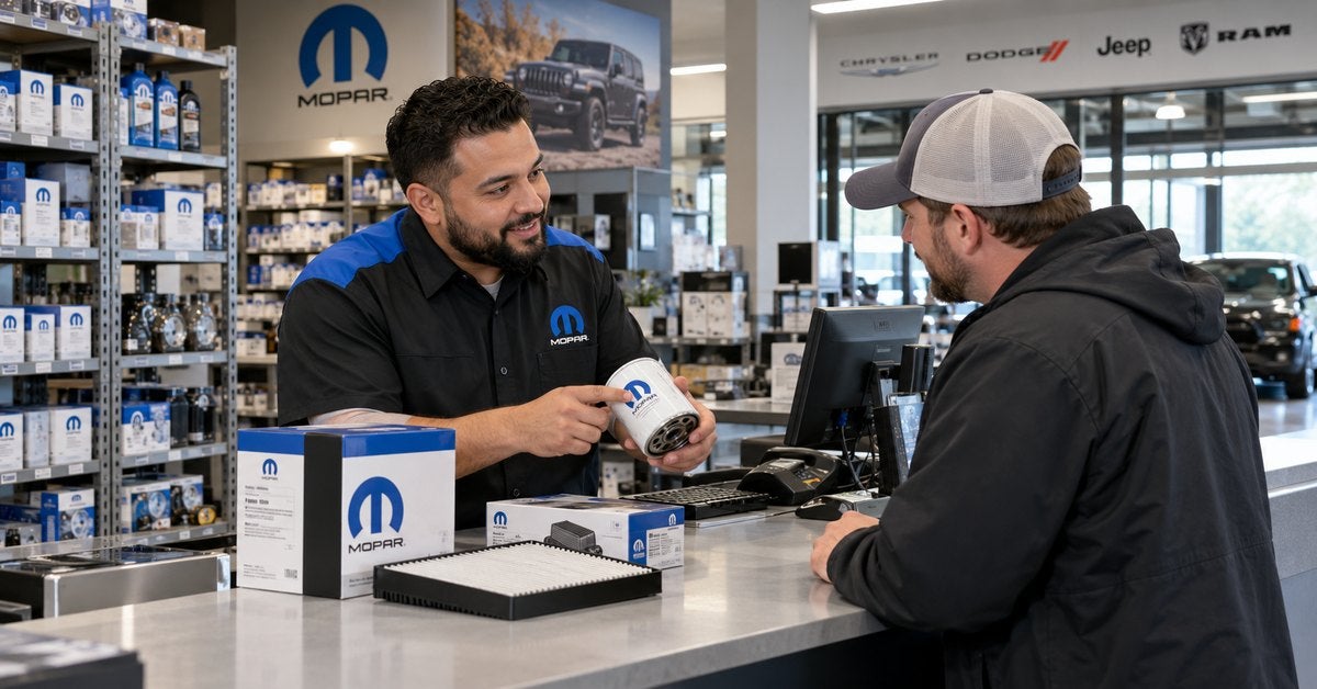 Illustration of a parts specialist assisting a customer with a Mopar oil filter at a parts counter