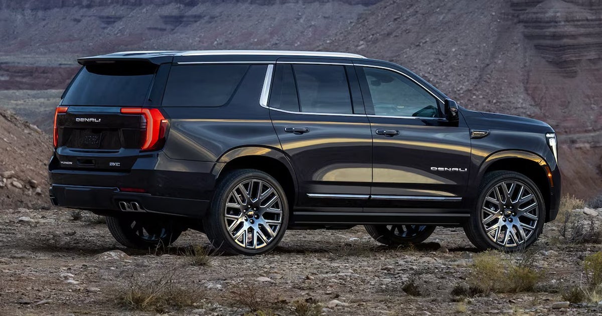 2025 GMC Yukon Denali full-size SUV in dark gray showcasing premium exterior styling